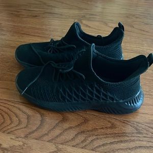 Black slip-on tennis shoes. Size 41 EU (women’s 9.5/10). New without tags